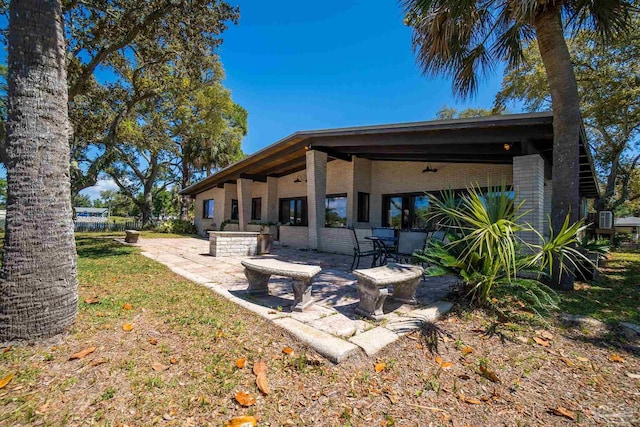 back of property featuring a patio area