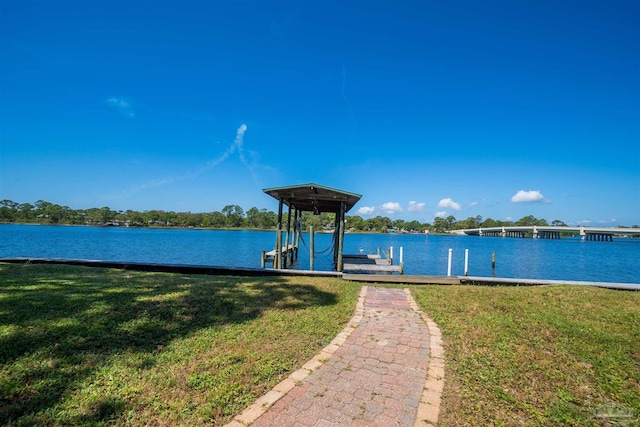 dock area featuring a yard and a water view