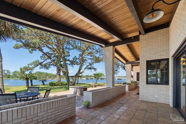 view of patio featuring a water view