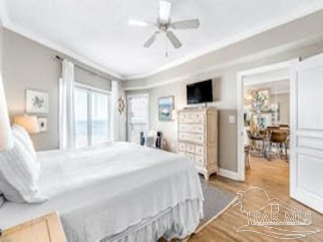 22984 Perdido Beach Blvd Unit B42, Orange Beach, AL 36561 - bedroom with ceiling fan, ornamental molding, and wood finished floors