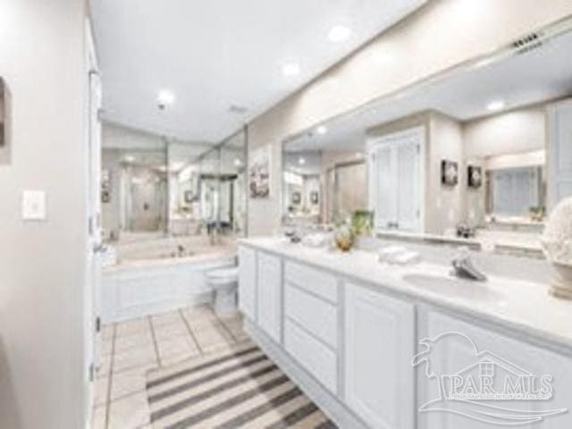 22984 Perdido Beach Blvd Unit B42, Orange Beach, AL 36561 - full bathroom with recessed lighting, double vanity, visible vents, a sink, and a bath