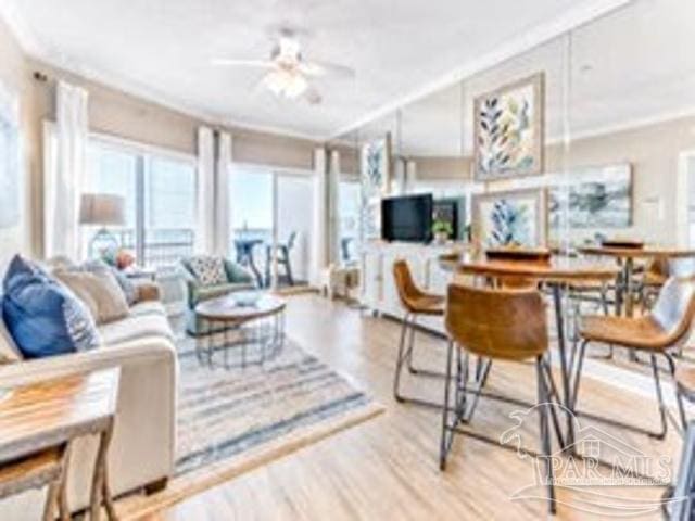 22984 Perdido Beach Blvd Unit B42, Orange Beach, AL 36561 - living area with ceiling fan, ornamental molding, and wood finished floors