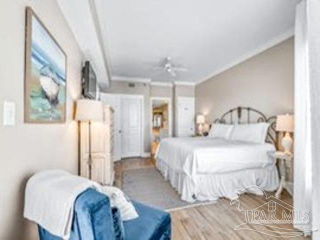 22984 Perdido Beach Blvd Unit B42, Orange Beach, AL 36561 - bedroom with ornamental molding and wood finished floors