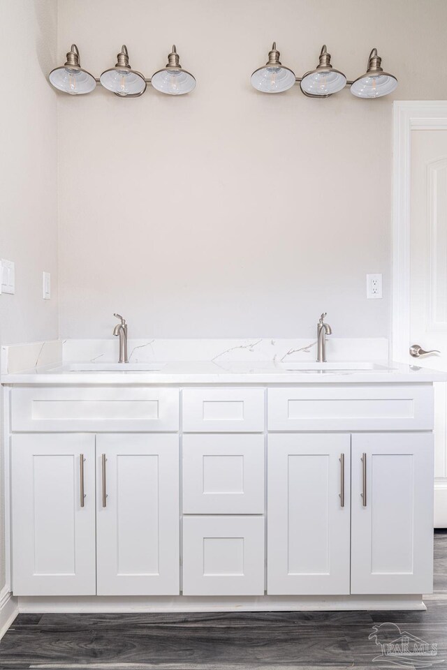 bathroom with vanity and hardwood / wood-style flooring