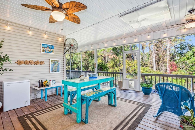 wooden deck featuring ceiling fan