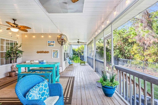 wooden deck featuring ceiling fan