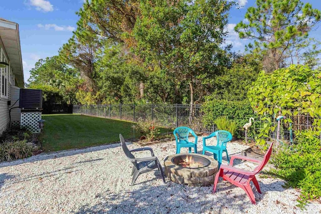 view of yard with a fire pit