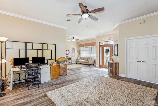 office space with crown molding, ceiling fan, a textured ceiling, and hardwood / wood-style flooring