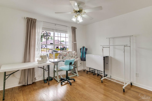 office area with ceiling fan, wood finished floors, and baseboards
