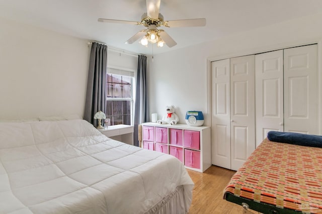 bedroom featuring a closet, ceiling fan, and light wood-type flooring