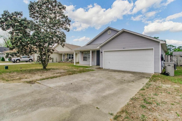 single story home featuring a front yard, driveway, and a garage