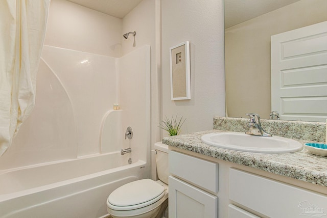 full bathroom with toilet, vanity, and tub / shower combination