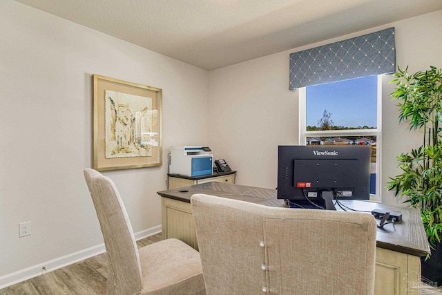 office space with hardwood / wood-style floors and a textured ceiling