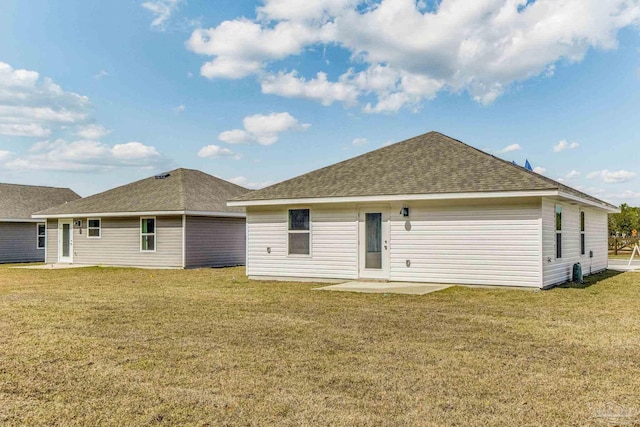 back of house featuring a yard and a patio