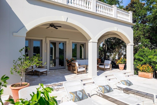 view of patio / terrace with outdoor lounge area, french doors, a balcony, and ceiling fan