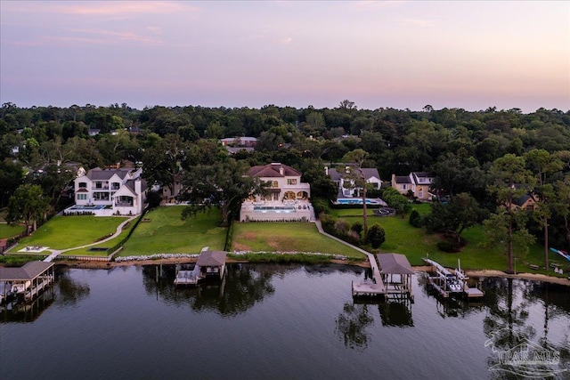 aerial view at dusk with a water view