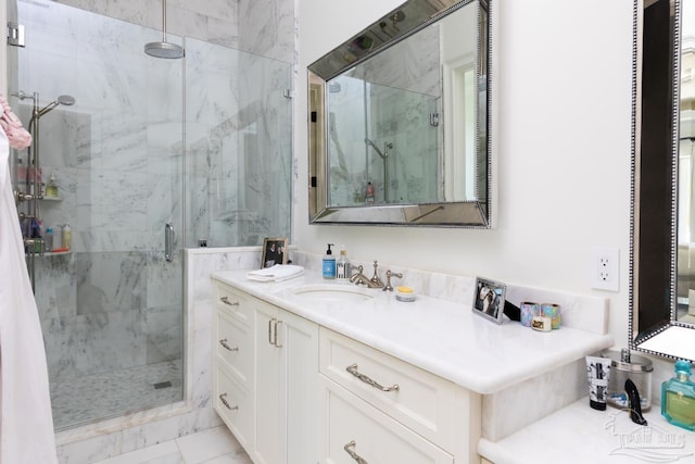 bathroom featuring vanity and an enclosed shower