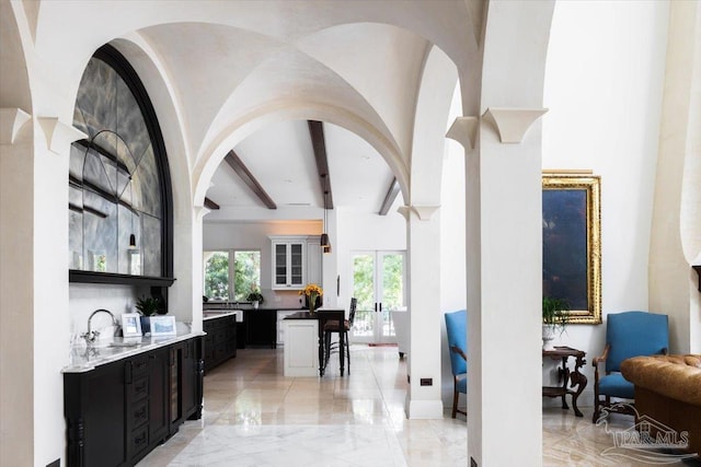 bar with beamed ceiling and sink