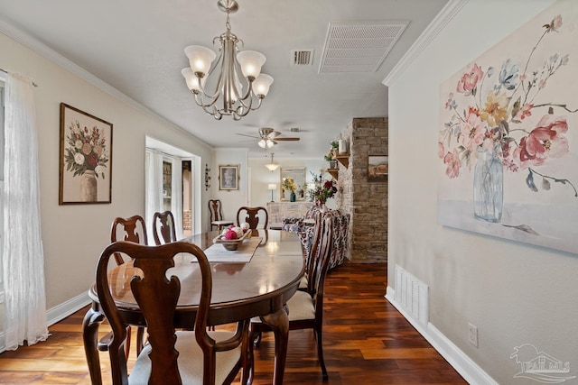 dining room featuring ceiling fan with notable chandelier, dark wood-type flooring, and ornamental molding