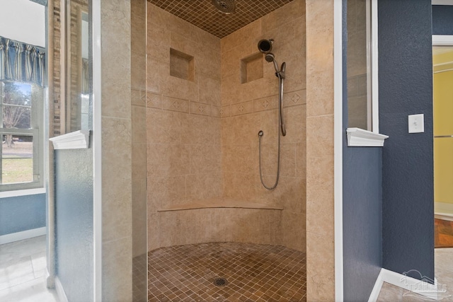 bathroom with a tile shower