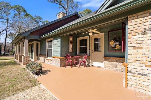 view of exterior entry with ceiling fan