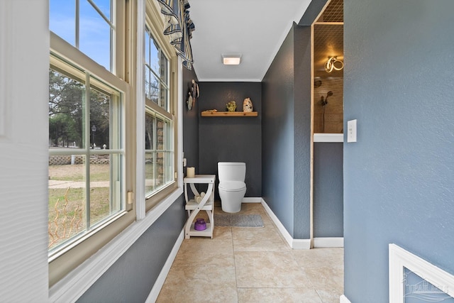 bathroom with tile patterned flooring and toilet