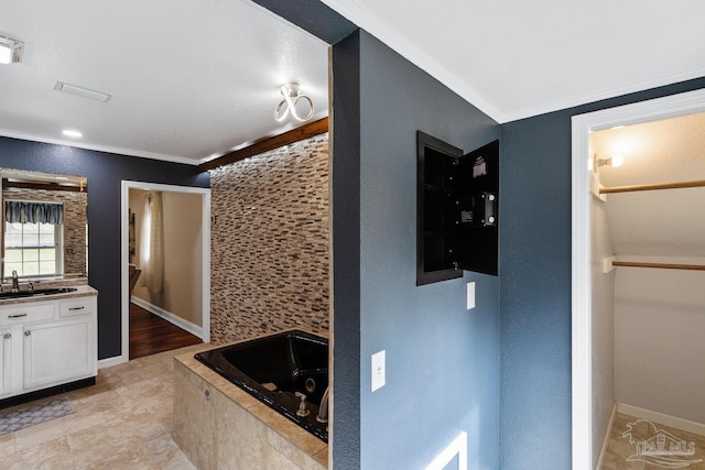 bathroom featuring tasteful backsplash, ornamental molding, separate shower and tub, and vanity