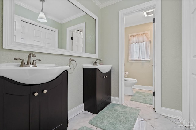 bathroom with ornamental molding, vanity, tile patterned floors, and toilet