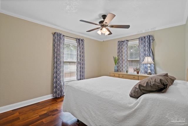 bedroom featuring dark hardwood / wood-style flooring, crown molding, a textured ceiling, and ceiling fan