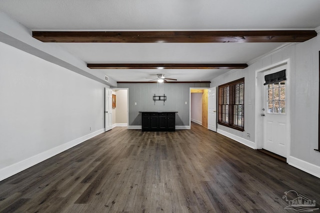 unfurnished living room featuring beam ceiling, dark wood-type flooring, and ceiling fan