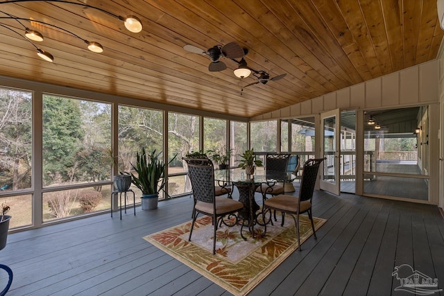 sunroom / solarium with ceiling fan, lofted ceiling, and wooden ceiling