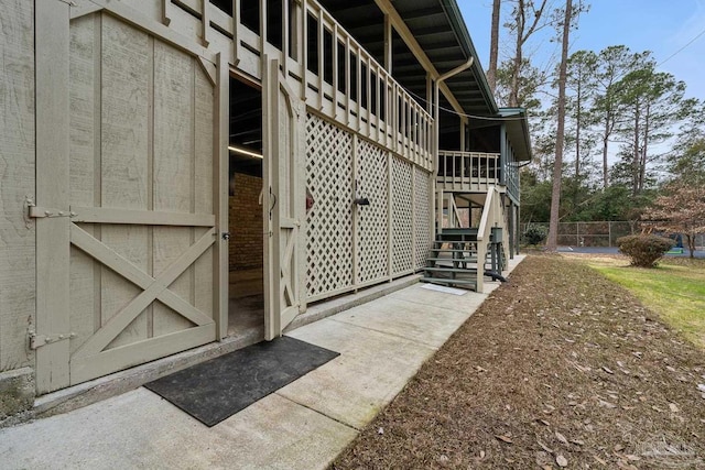 view of home's exterior with an outbuilding