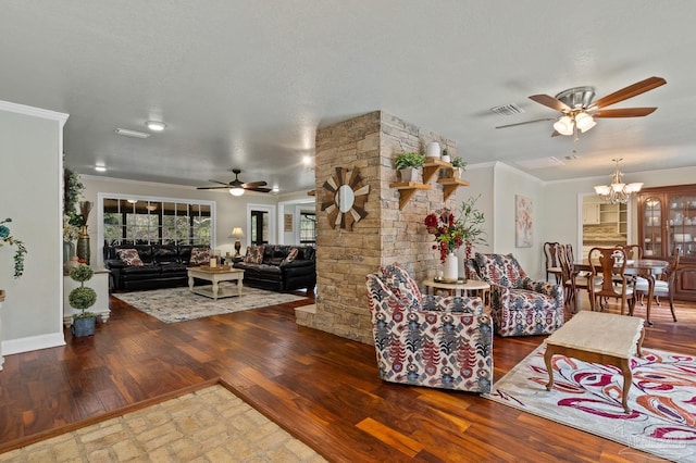 living room featuring ceiling fan with notable chandelier, wood-type flooring, ornamental molding, and a textured ceiling