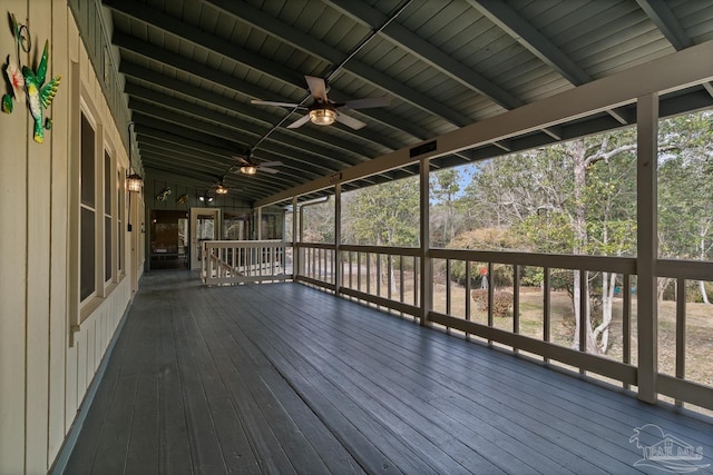 wooden deck featuring ceiling fan