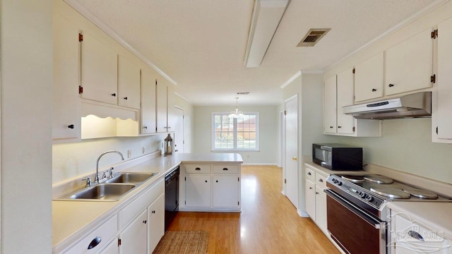 kitchen with pendant lighting, sink, white cabinetry, black appliances, and light wood-type flooring