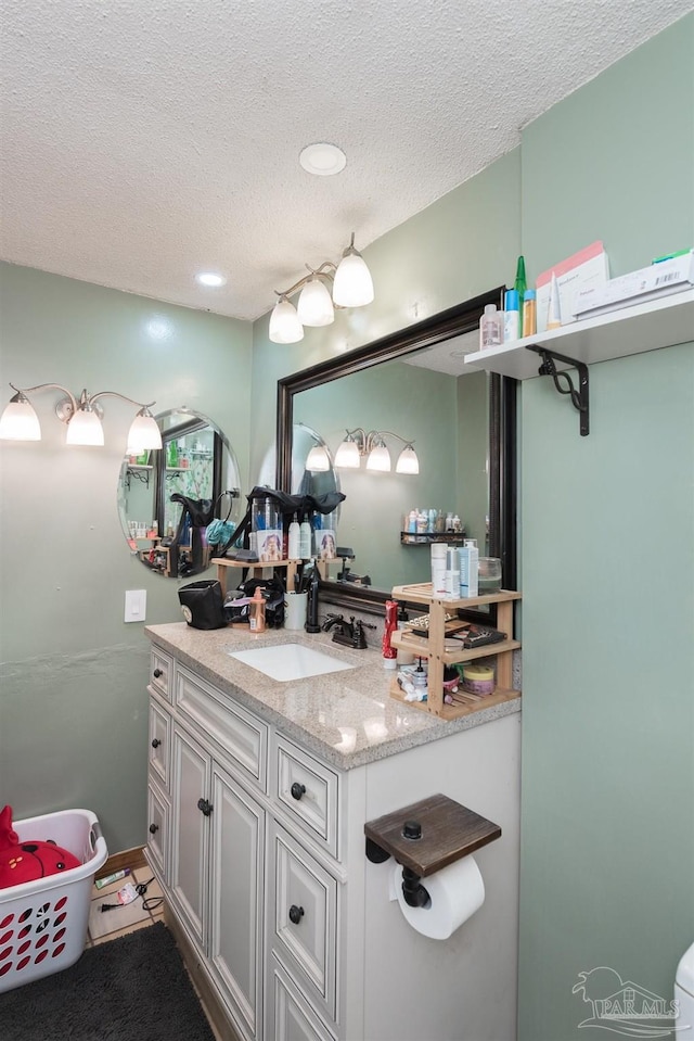 2322 Silversides Loop, Pensacola, FL 32526 - bathroom featuring vanity, a textured ceiling, and recessed lighting