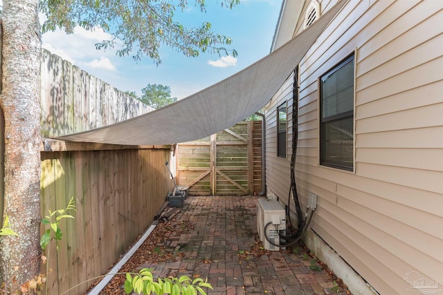 2322 Silversides Loop, Pensacola, FL 32526 - view of home's exterior featuring ac unit and a patio area