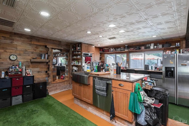 2322 Silversides Loop, Pensacola, FL 32526 - kitchen featuring stainless steel appliances, a sink, an ornate ceiling, open shelves, and wood walls