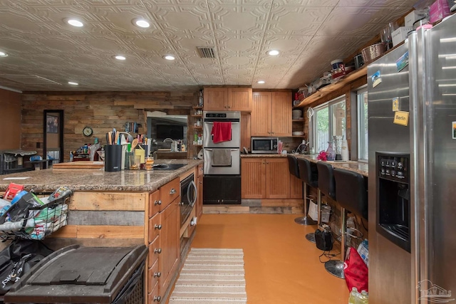 2322 Silversides Loop, Pensacola, FL 32526 - kitchen with appliances with stainless steel finishes, recessed lighting, finished concrete floors, open shelves, and an ornate ceiling