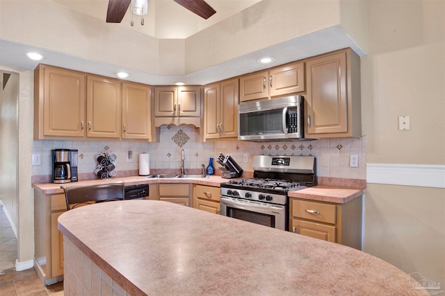 kitchen featuring tasteful backsplash, light brown cabinetry, sink, ceiling fan, and stainless steel appliances