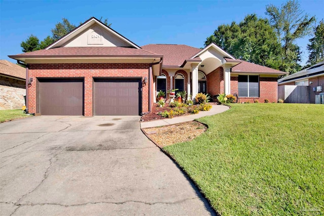 single story home featuring a front yard and a garage