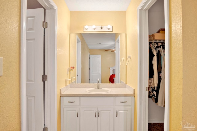 bathroom with vanity and ceiling fan