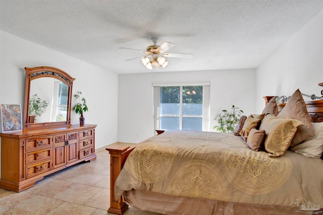 bedroom with light tile patterned flooring, a textured ceiling, and ceiling fan