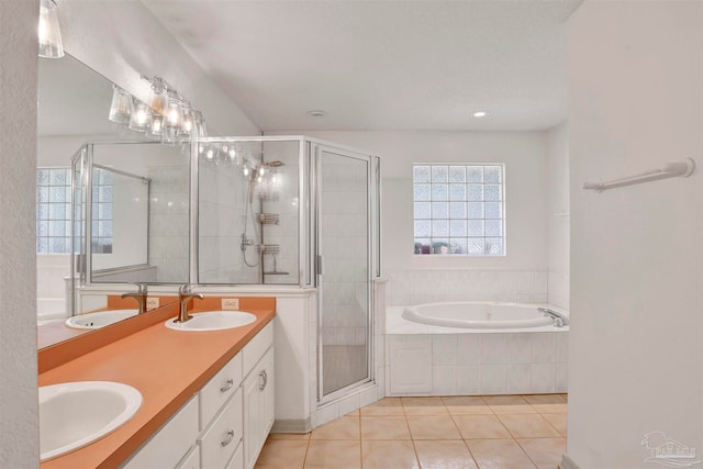 bathroom with vanity, shower with separate bathtub, and tile patterned flooring