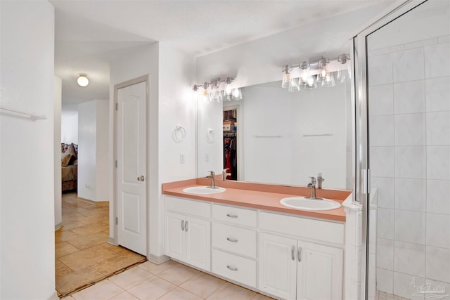 bathroom with vanity and an enclosed shower