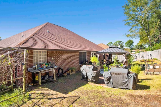 rear view of property with a gazebo