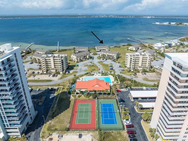 drone / aerial view with a city view and a water view