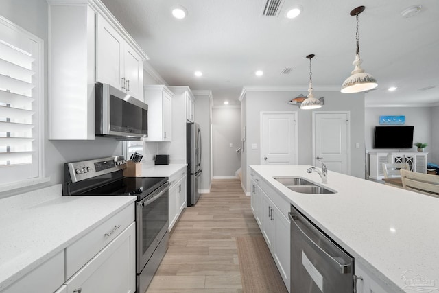 kitchen with recessed lighting, a sink, visible vents, white cabinetry, and appliances with stainless steel finishes