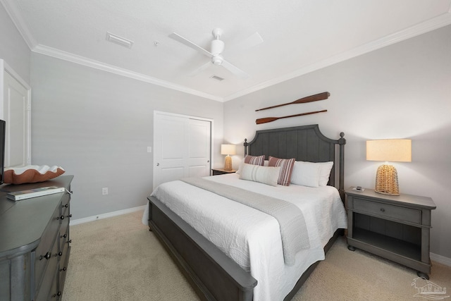 bedroom featuring light colored carpet, crown molding, and baseboards