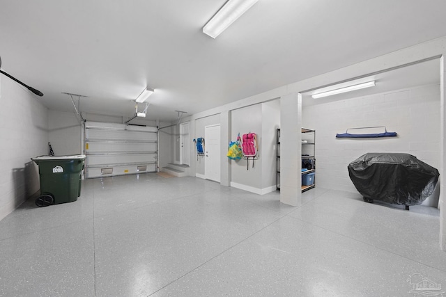 garage with concrete block wall